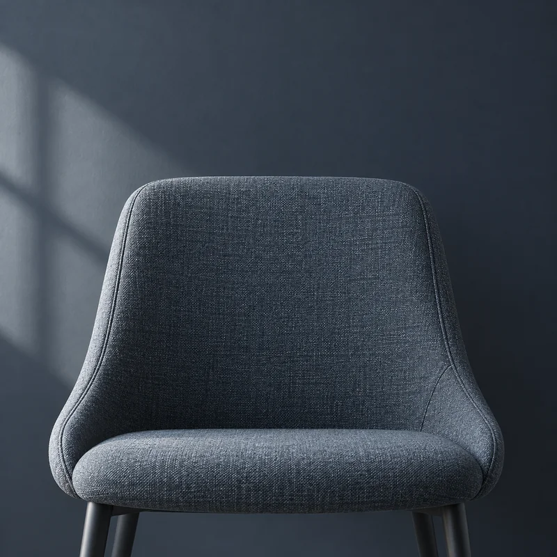 Temporary team portrait placeholder: an empty slate chair